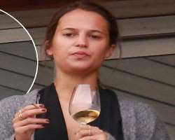 Alicia Vikander consuming alcohol